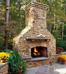 Custom Stone Fireplace completes a Backyard Design by GA Landscape Design