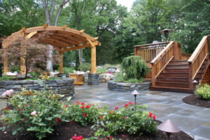 Blue Stone Patio with stone walls complete the landscaping of this Westfield NJ backyard