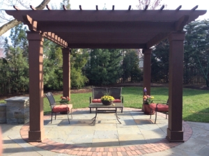 Seating area under a pergola in a New Jersey Backyard