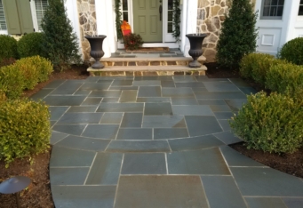Bluestone Entry with plantings to line the way complete this front landscape design