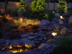 Landscape Lighting completes the look of this backyard landscaping