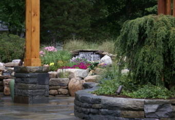 Custom Stone Walls and Waterfall create a relaxing landscape