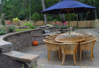 Summit NJ Outdoor Living with custom waterfall built into a retaining wall